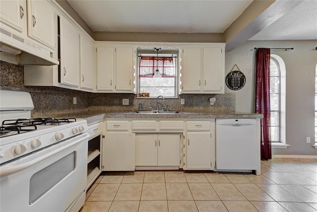 1021 SW 1st St, Moore, OK 73160 - kitchen featuring white appliances, ventilation hood, tasteful backsplash, and light tile patterned floors