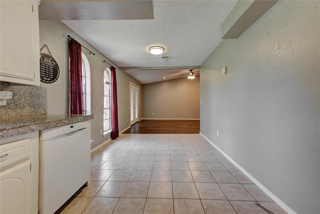 1021 SW 1st St, Moore, OK 73160 - unfurnished dining area with a ceiling fan, light tile patterned floors, and a textured ceiling