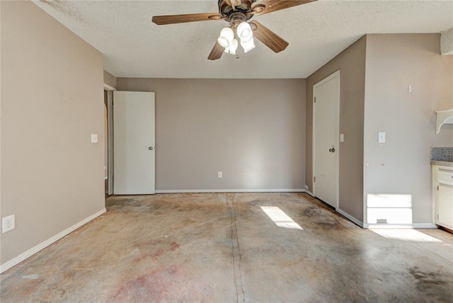 1021 SW 1st St, Moore, OK 73160 - unfurnished room featuring unfinished concrete flooring, a textured ceiling, and a ceiling fan