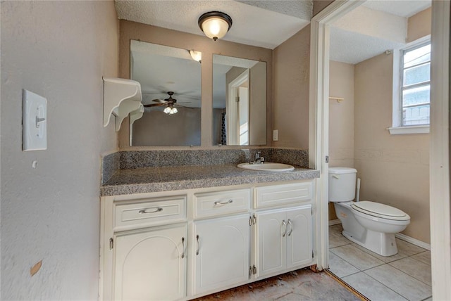 1021 SW 1st St, Moore, OK 73160 - bathroom featuring vanity, a ceiling fan, and tile patterned floors