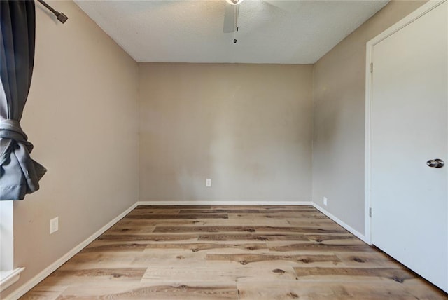 1021 SW 1st St, Moore, OK 73160 - unfurnished room with wood finished floors, ceiling fan, and a textured ceiling