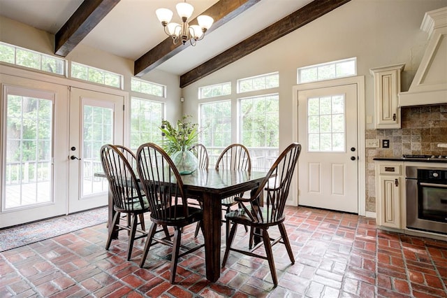 5305 Circle Gln, Edmond, OK 73025 - dining room with brick floors, a chandelier, and french doors