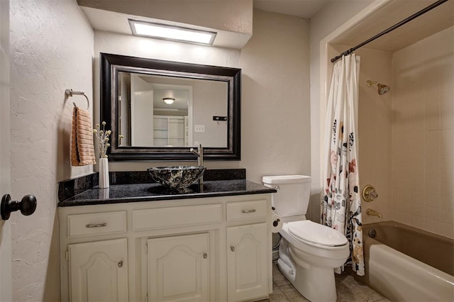5305 Circle Gln, Edmond, OK 73025 - bathroom featuring vanity, shower / bathtub combination with curtain, a textured wall, and tile patterned flooring