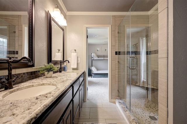 5305 Circle Gln, Edmond, OK 73025 - bathroom with double vanity, ornamental molding, and a stall shower