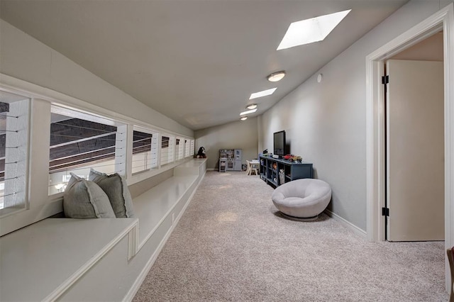 5305 Circle Gln, Edmond, OK 73025 - living area featuring carpet flooring, a skylight, and lofted ceiling