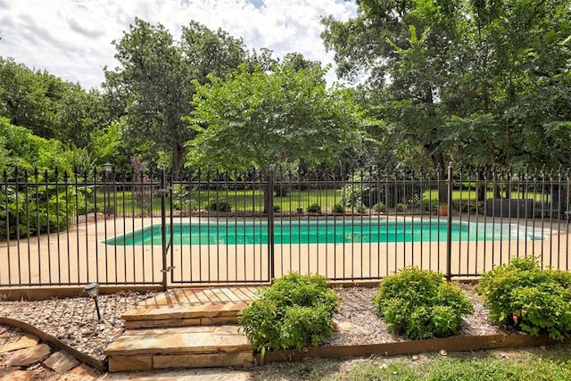 5305 Circle Gln, Edmond, OK 73025 - view of swimming pool with view of wooded area