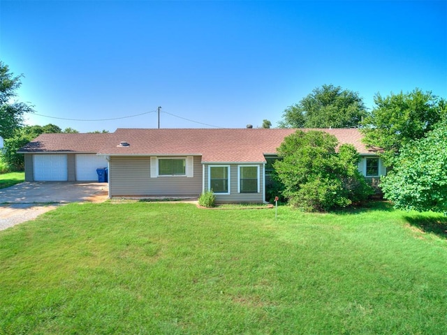 2618 NW Apache Rd, Piedmont, OK 73078 - ranch-style house with a front yard, driveway, roof with shingles, and an attached garage