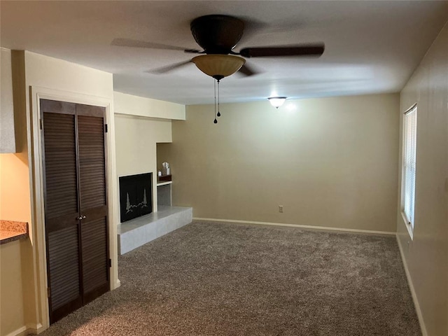 600 NW 4th St Unit 305N, Oklahoma City, OK 73102 - unfurnished living room with carpet and a ceiling fan