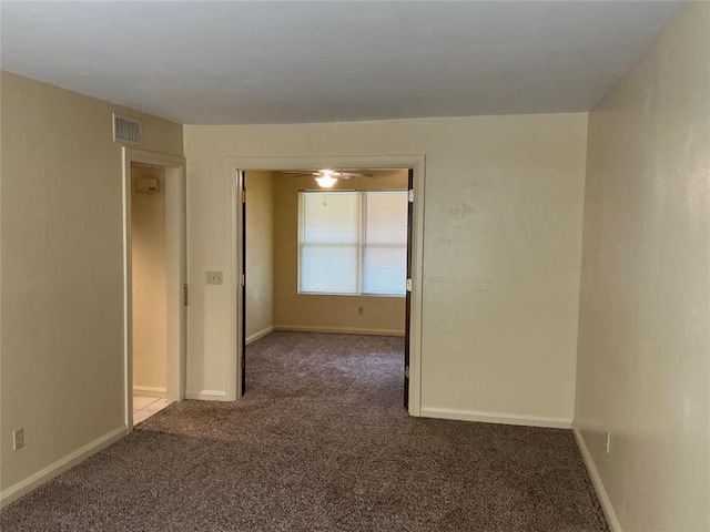 600 NW 4th St Unit 305N, Oklahoma City, OK 73102 - spare room featuring carpet floors and baseboards