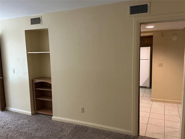 600 NW 4th St Unit 305N, Oklahoma City, OK 73102 - empty room with a smoke detector and light tile patterned flooring