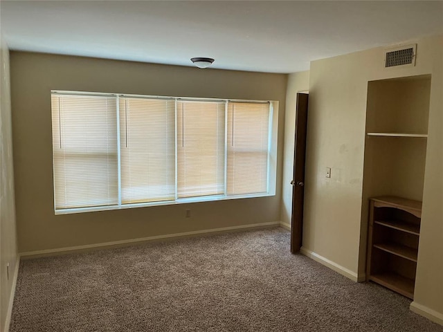 600 NW 4th St Unit 305N, Oklahoma City, OK 73102 - unfurnished bedroom with carpet flooring and baseboards