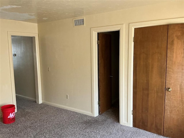 600 NW 4th St Unit 305N, Oklahoma City, OK 73102 - unfurnished bedroom featuring carpet flooring and baseboards