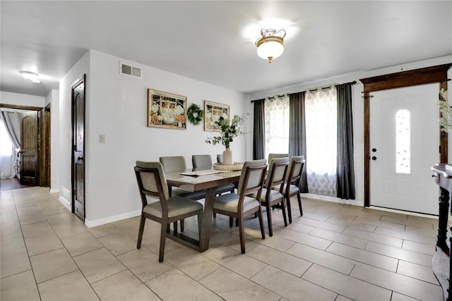 7007 NW 61st St, Bethany, OK 73008 - dining area with baseboards and light tile patterned floors