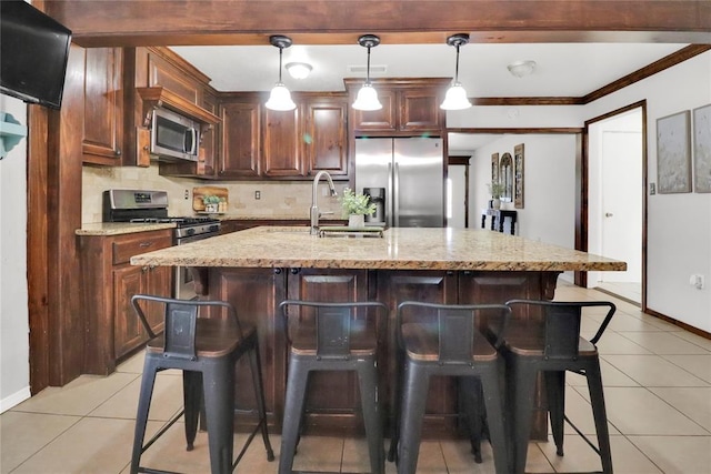 7007 NW 61st St, Bethany, OK 73008 - kitchen with appliances with stainless steel finishes, a breakfast bar, tasteful backsplash, light tile patterned floors, and crown molding