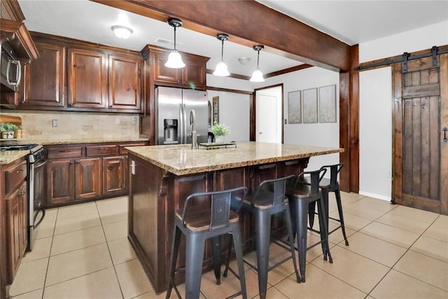 7007 NW 61st St, Bethany, OK 73008 - kitchen featuring stainless steel appliances, light tile patterned flooring, decorative backsplash, and light stone counters