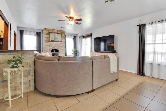 7007 NW 61st St, Bethany, OK 73008 - living area featuring healthy amount of natural light, a ceiling fan, and light tile patterned flooring