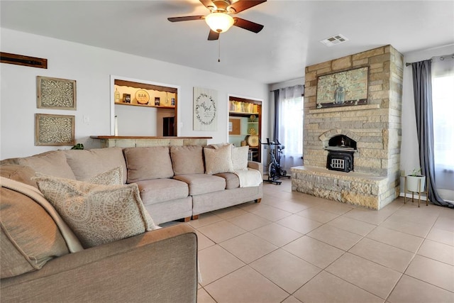 7007 NW 61st St, Bethany, OK 73008 - living room with light tile patterned floors, ceiling fan, and healthy amount of natural light