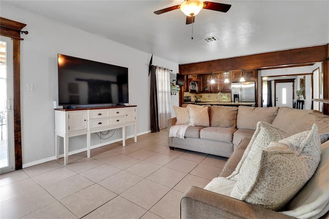 7007 NW 61st St, Bethany, OK 73008 - living room featuring light tile patterned floors and a ceiling fan