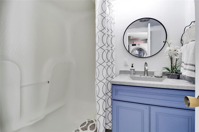 7007 NW 61st St, Bethany, OK 73008 - bathroom featuring washer / clothes dryer, vanity, and curtained shower