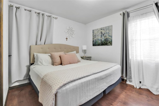 7007 NW 61st St, Bethany, OK 73008 - bedroom featuring wood finished floors and baseboards