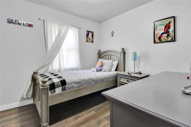 7007 NW 61st St, Bethany, OK 73008 - bedroom featuring dark wood finished floors