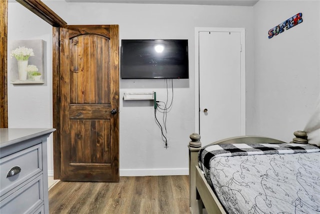 7007 NW 61st St, Bethany, OK 73008 - bedroom with wood finished floors and baseboards