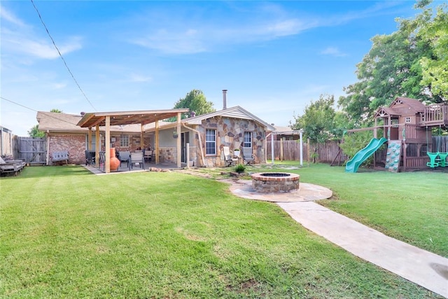 7007 NW 61st St, Bethany, OK 73008 - fenced backyard featuring a fire pit, a patio, and a playground