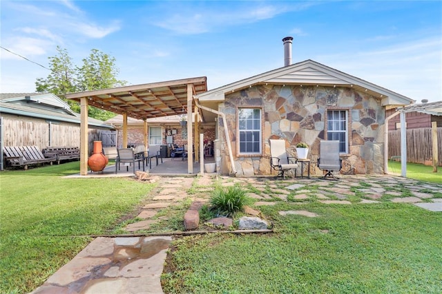7007 NW 61st St, Bethany, OK 73008 - back of house featuring a fenced backyard, stone siding, and a patio