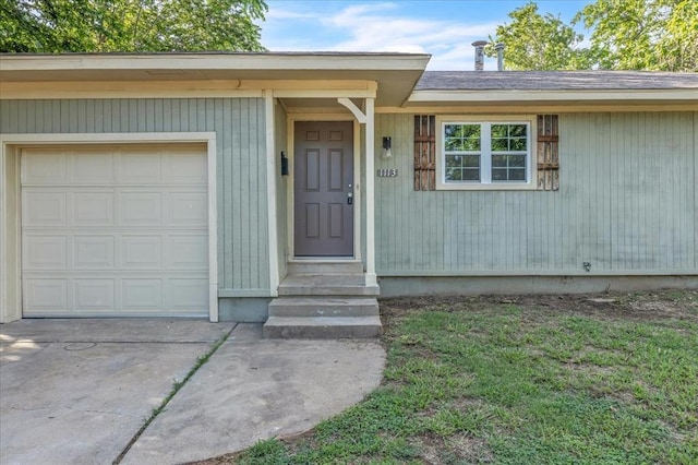 1113 S Locust Dr, Midwest City, OK 73110 - property entrance featuring a garage and concrete driveway