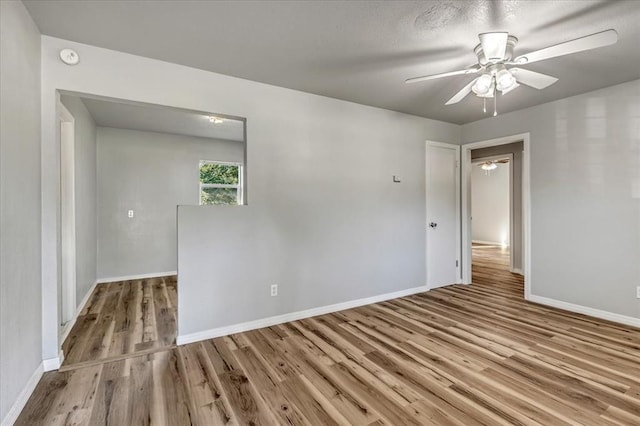 1113 S Locust Dr, Midwest City, OK 73110 - spare room featuring wood finished floors and ceiling fan