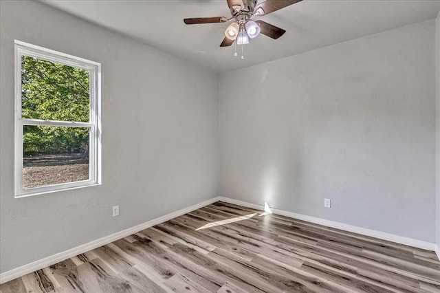 1113 S Locust Dr, Midwest City, OK 73110 - empty room with wood finished floors and a ceiling fan