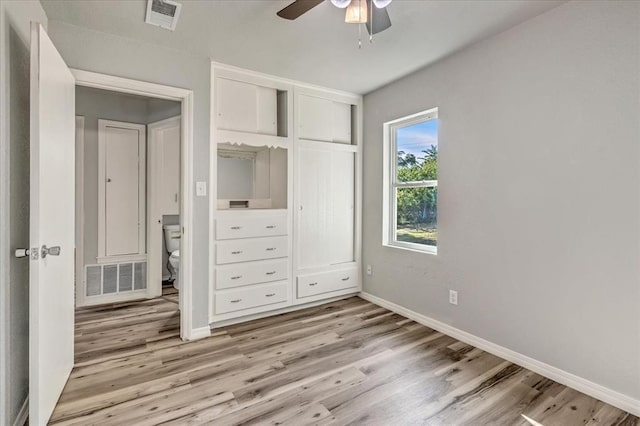 1113 S Locust Dr, Midwest City, OK 73110 - unfurnished bedroom featuring light wood finished floors, a closet, and ceiling fan