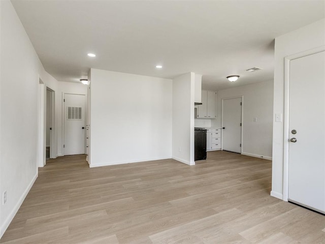 2340 SW 46th St, Oklahoma City, OK 73119 - unfurnished living room featuring light wood-type flooring and recessed lighting