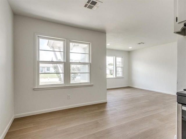 2340 SW 46th St, Oklahoma City, OK 73119 - unfurnished living room featuring light wood-style floors and recessed lighting