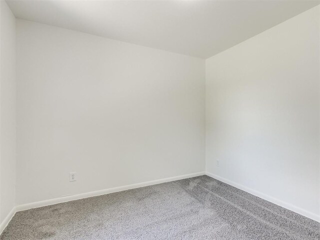 2340 SW 46th St, Oklahoma City, OK 73119 - spare room featuring carpet flooring and baseboards