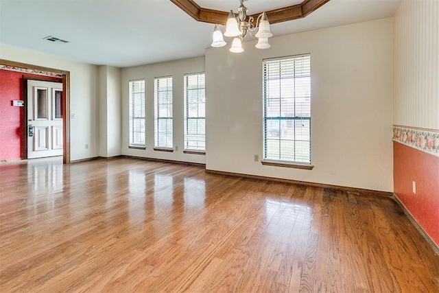 10201 Mantle Ct, Oklahoma City, OK 73162 - empty room with a chandelier and light wood-style flooring