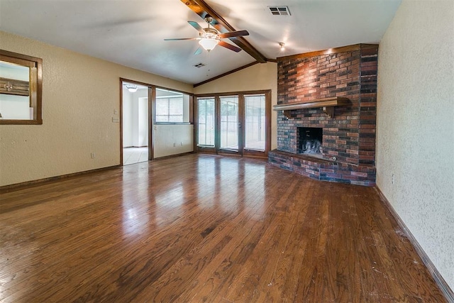 10201 Mantle Ct, Oklahoma City, OK 73162 - unfurnished living room with wood finished floors, a ceiling fan, a textured wall, and a fireplace
