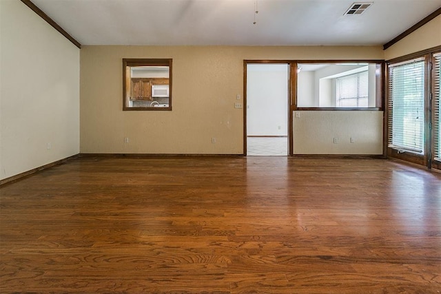 10201 Mantle Ct, Oklahoma City, OK 73162 - unfurnished room with dark wood-style floors and ornamental molding