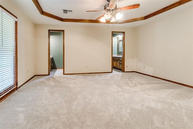 10201 Mantle Ct, Oklahoma City, OK 73162 - spare room with a raised ceiling, light colored carpet, a ceiling fan, and ornamental molding