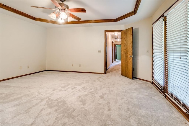 10201 Mantle Ct, Oklahoma City, OK 73162 - unfurnished room with healthy amount of natural light, a tray ceiling, light carpet, and ceiling fan