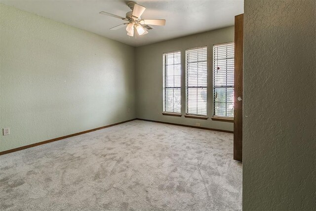 10201 Mantle Ct, Oklahoma City, OK 73162 - spare room featuring a textured wall, carpet flooring, and ceiling fan