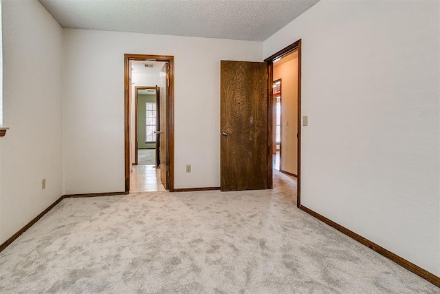 10201 Mantle Ct, Oklahoma City, OK 73162 - unfurnished bedroom featuring carpet flooring and a textured ceiling