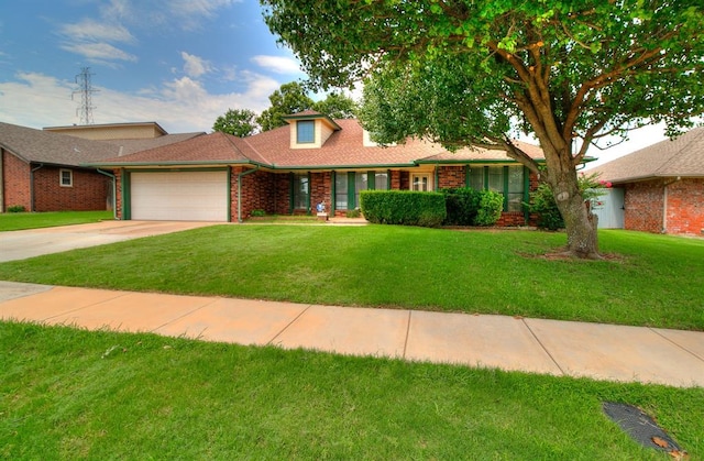 10201 Mantle Ct, Oklahoma City, OK 73162 - single story home with an attached garage, a front yard, concrete driveway, and brick siding