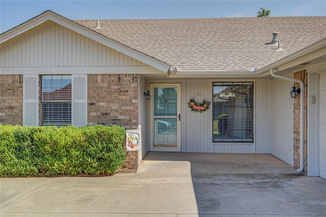 2109 Shamrock Dr, Edmond, OK 73003 - entrance to property featuring a shingled roof and stone siding