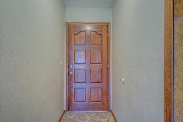2109 Shamrock Dr, Edmond, OK 73003 - entryway with baseboards and a textured wall