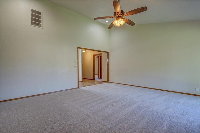 2109 Shamrock Dr, Edmond, OK 73003 - spare room with a ceiling fan, light colored carpet, and high vaulted ceiling