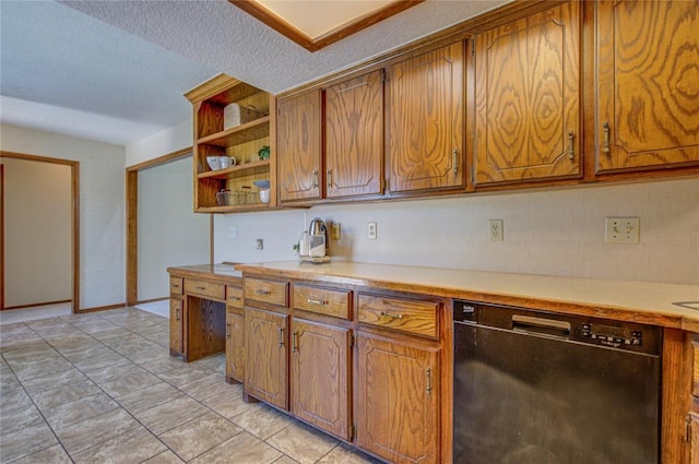 2109 Shamrock Dr, Edmond, OK 73003 - kitchen featuring dishwasher, light countertops, brown cabinets, and a textured ceiling