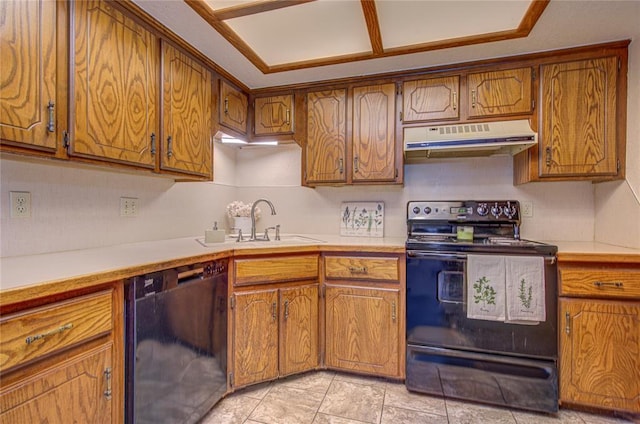 2109 Shamrock Dr, Edmond, OK 73003 - kitchen with black appliances, under cabinet range hood, brown cabinetry, and light countertops