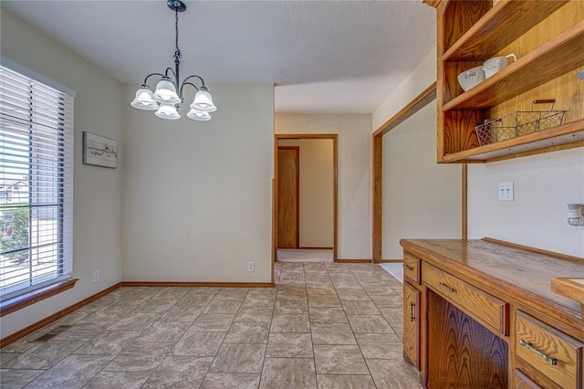 2109 Shamrock Dr, Edmond, OK 73003 - dining area with plenty of natural light and a chandelier