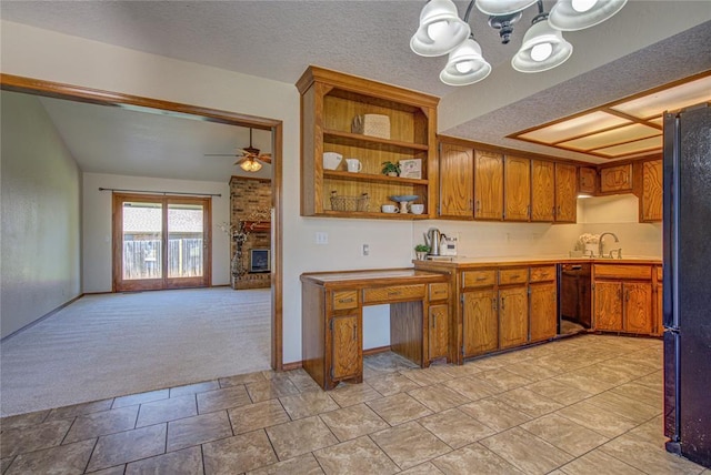 2109 Shamrock Dr, Edmond, OK 73003 - kitchen with black appliances, a chandelier, light carpet, brown cabinetry, and light countertops